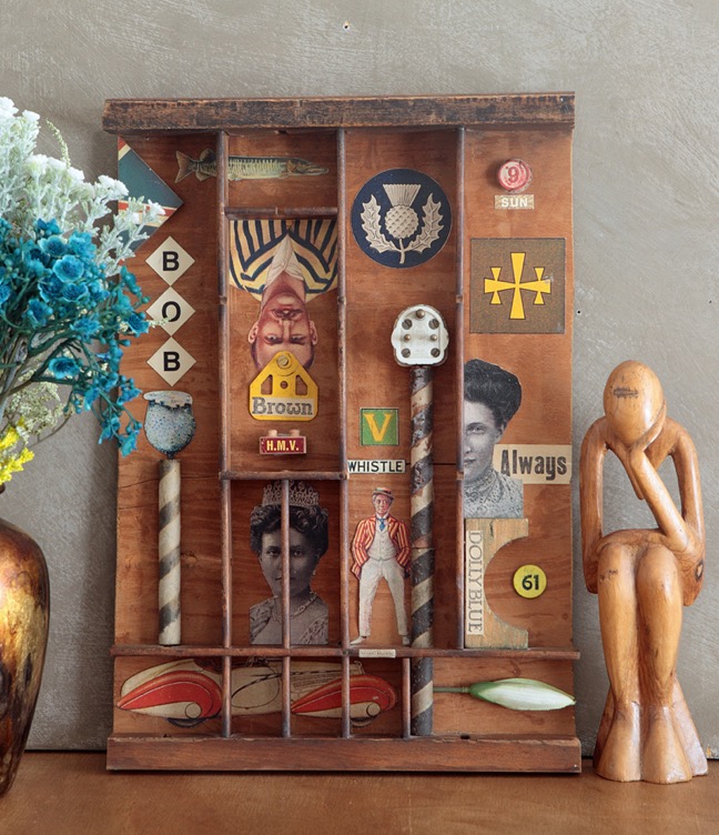 assemblage art in old antique printers tray
