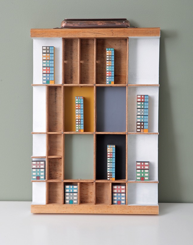 Bauhaus inspired artwork in old letterpress printers type case tray drawer