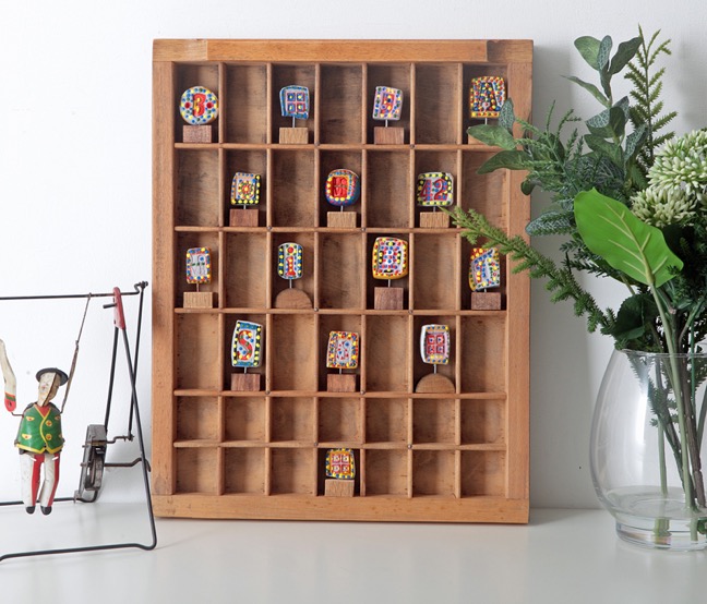 Little Collection of 15 Colourful Handmade Sculptures on Oak Plinths in Old Printers Tray