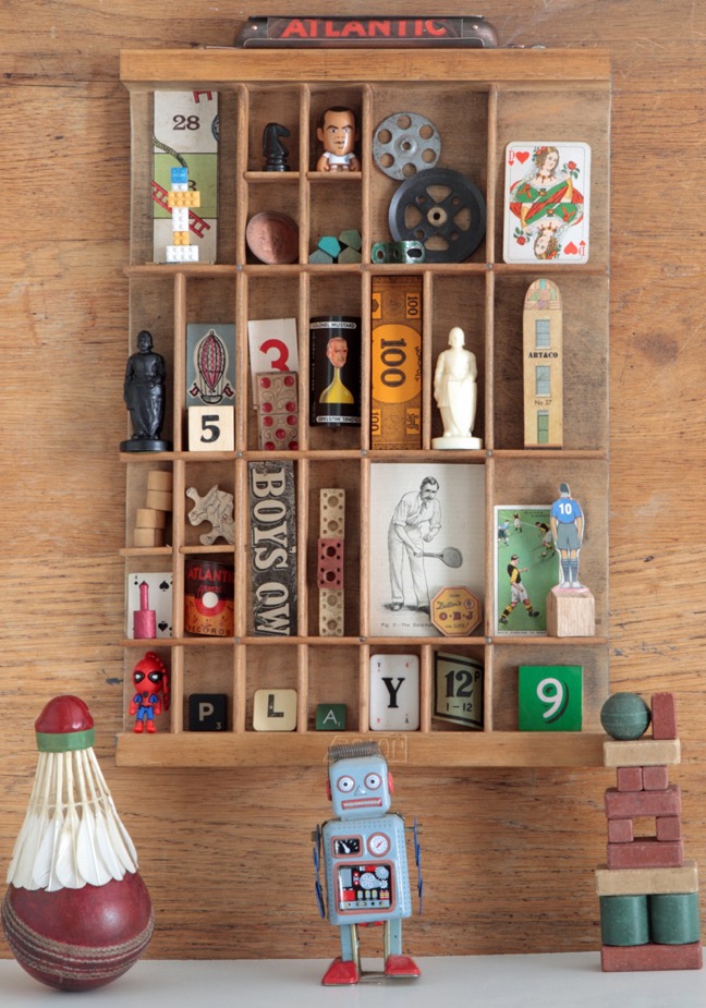 vintage games themed display in old letterpress printers drawer type case