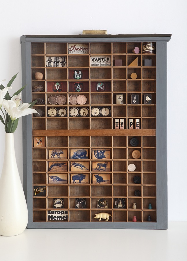 Up cycled Ludlow letterpress printers type case drawer used as a display for vintage curios