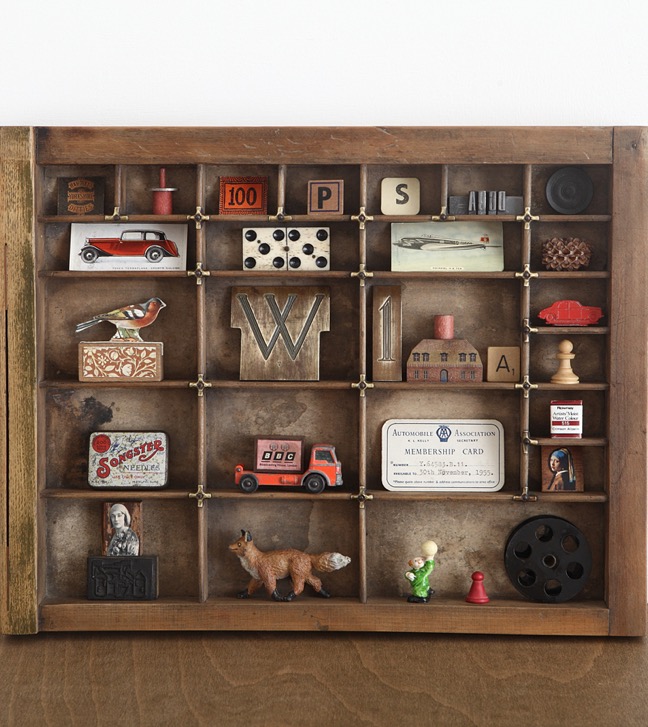 Old vintage type case used as a display for little vintage collectables