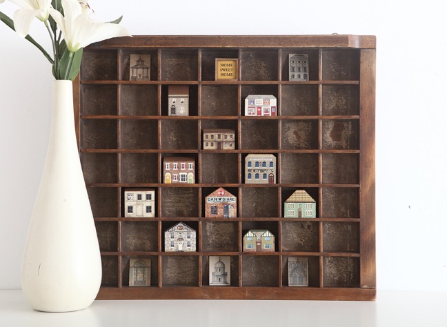 Antique printers tray re purposed as display for little handmade wooden houses