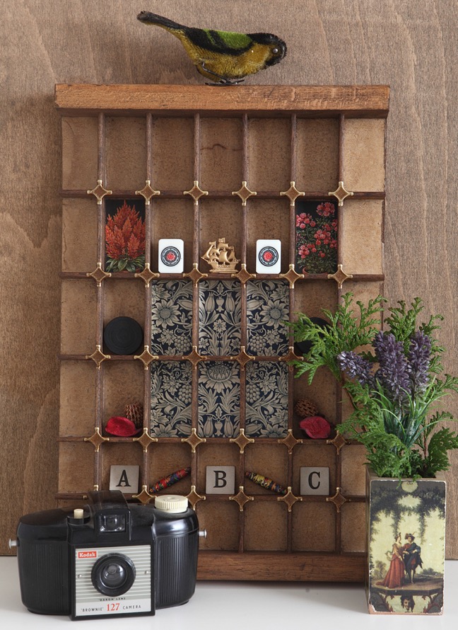 Decorative wall art display in re purposed vintage letterpress printers tray