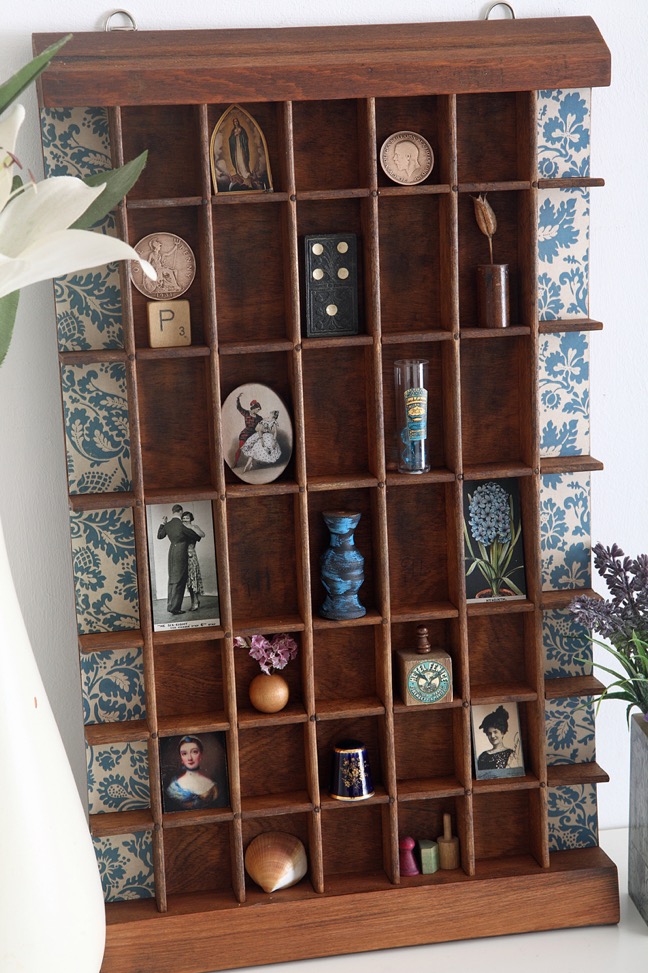 Decorative display of little curios in an up cycled Ludlow printers tray