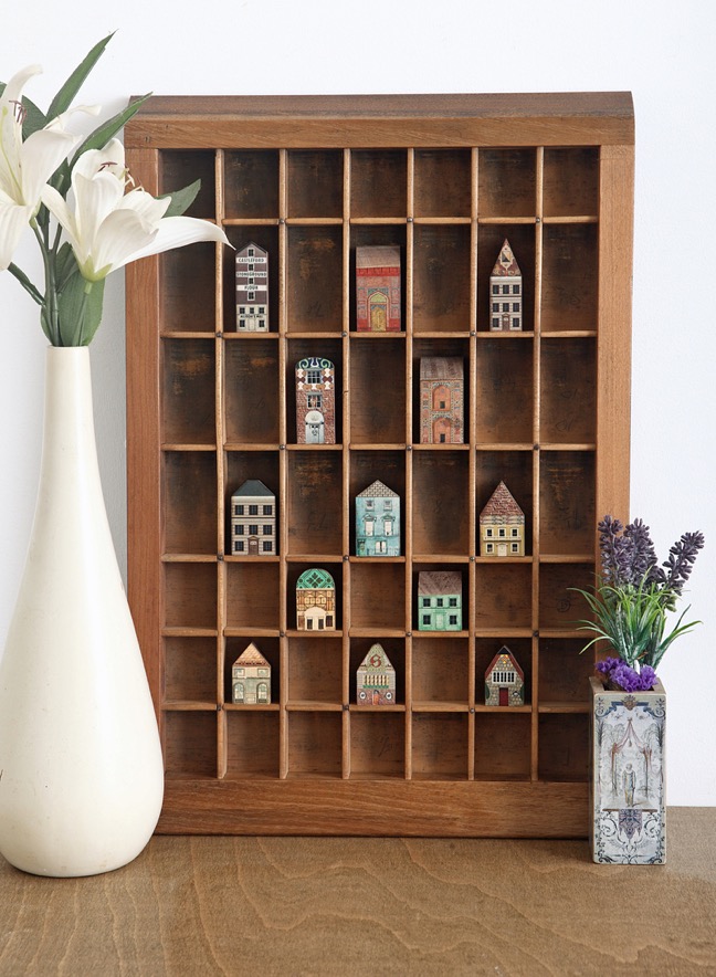 Re purposed vintage Ludlow printers tray used as a display for little quirky handmade houses & buildings