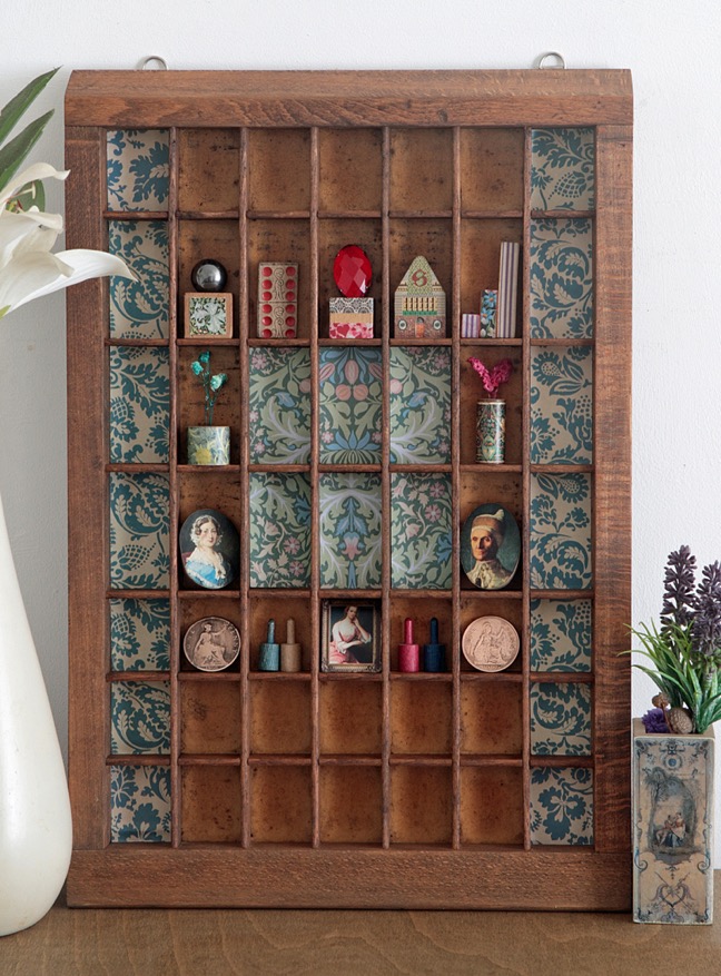 Great quirky display of little hand made curios and vintage items in an upcycled Ludlow printers type case 