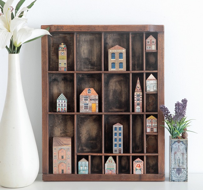 Antique letterpress printers type case used as a display case for vintage syle wooden houses & buildings 