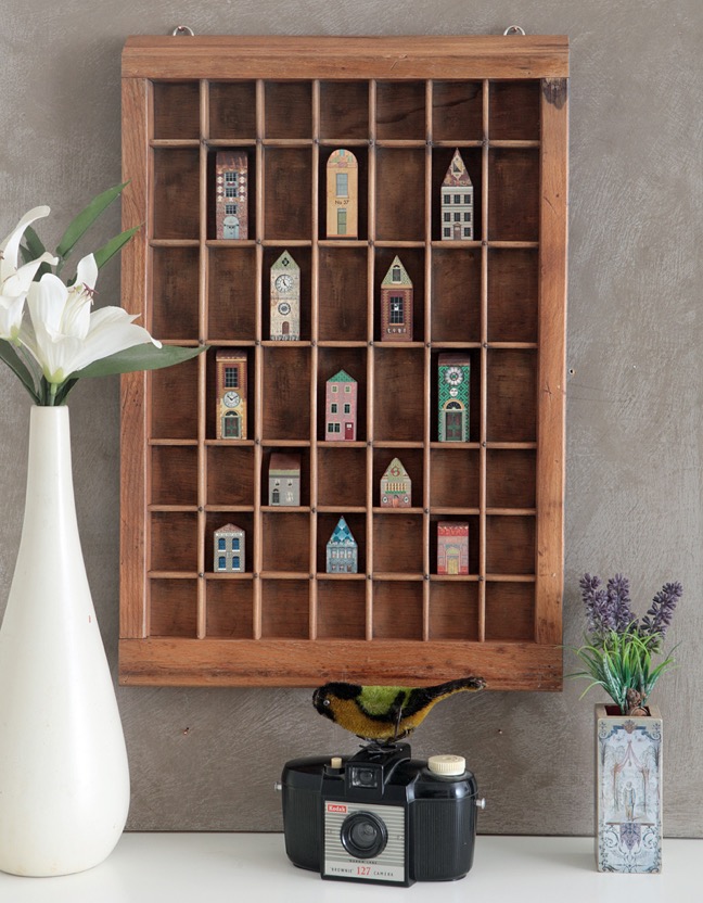 Vintage letterpress printers type case used as a display case for vintage syle wooden houses & buildings 