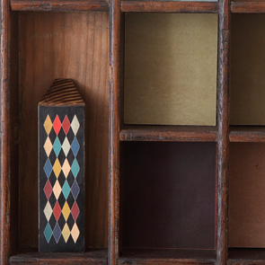 wooden printers tray artwork detail close up curios 